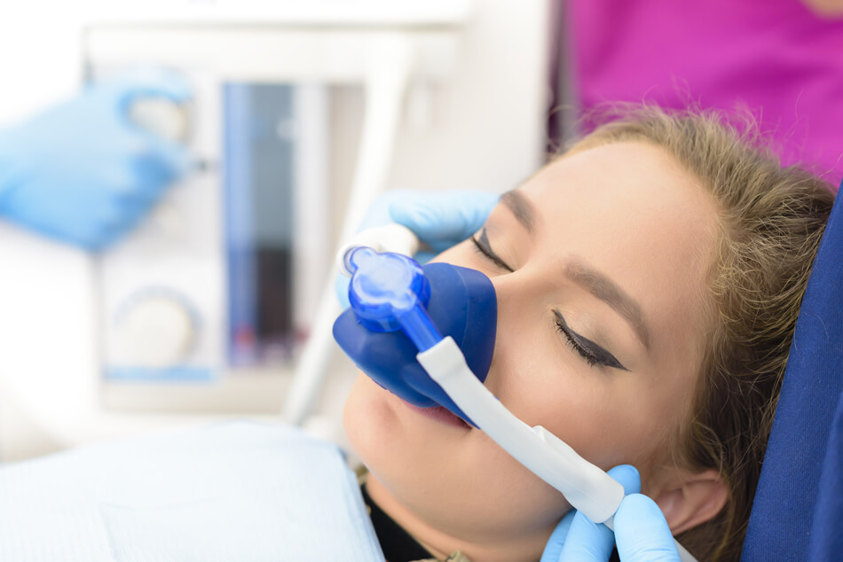 Patient receiving nitrous oxide sedation during a dental visit in North Bay